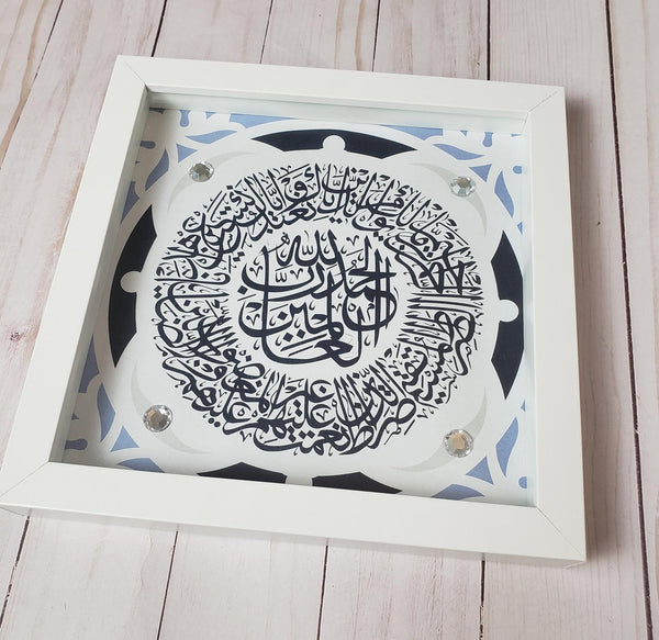 Surah Al Fatiha Islamic Art in a white shadowbox frame, ready to hang Modern Islamic Wall Art with black and gold beads and stones.